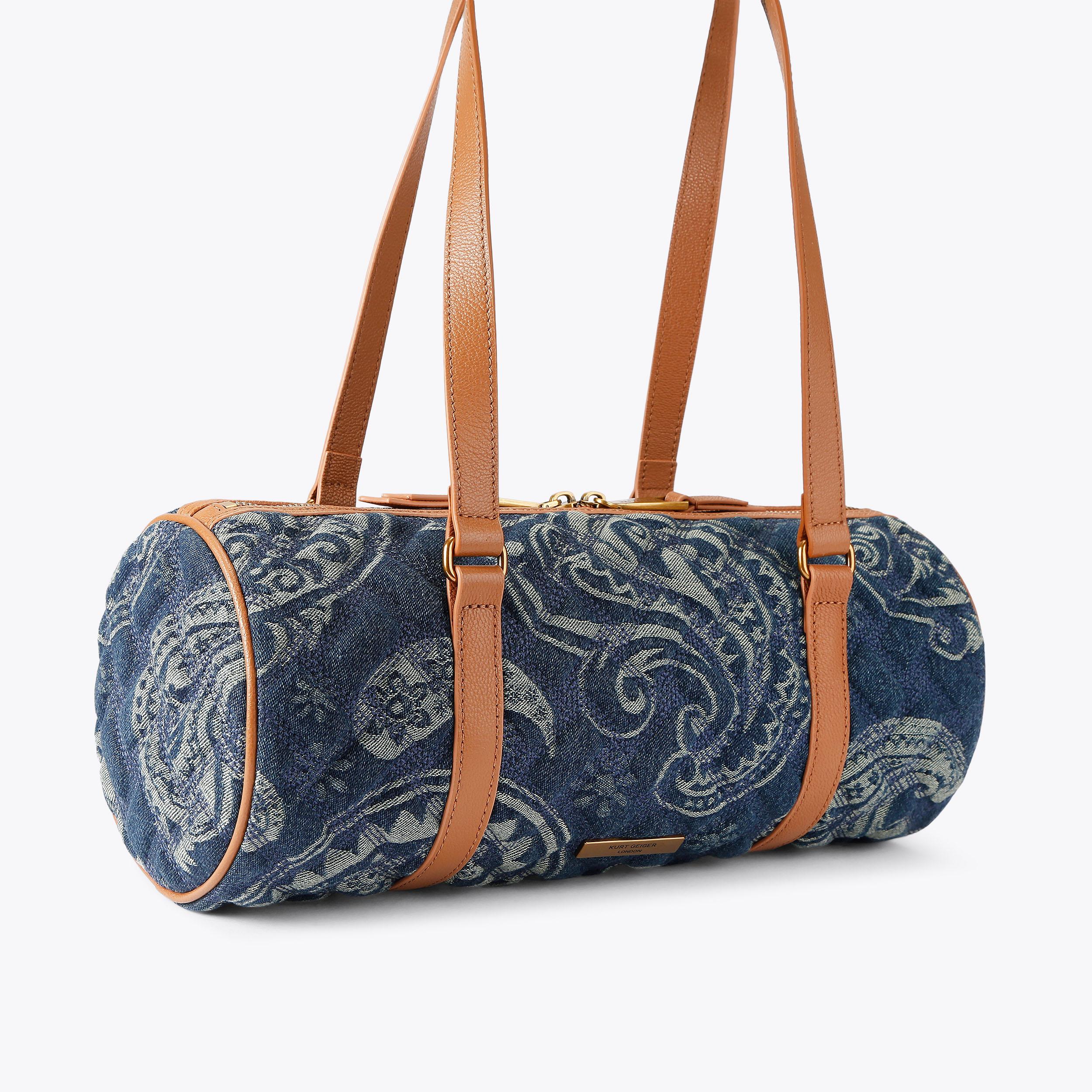 KENSINGTON BARREL Blue Denim Paisley Barrel Bag by Kurt Geiger London