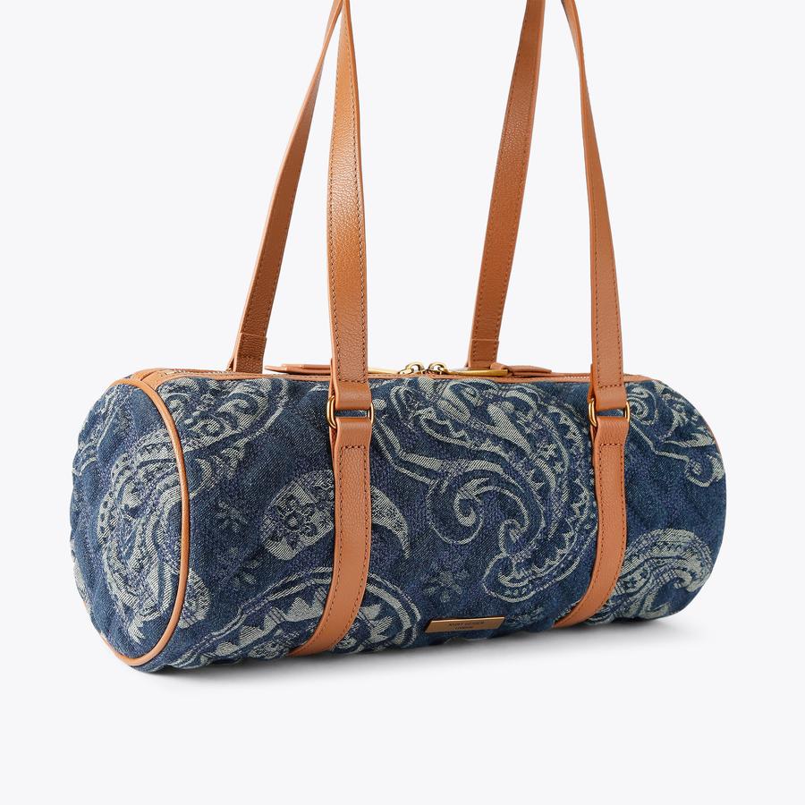 KENSINGTON BARREL Blue Denim Paisley Barrel Bag by Kurt Geiger London