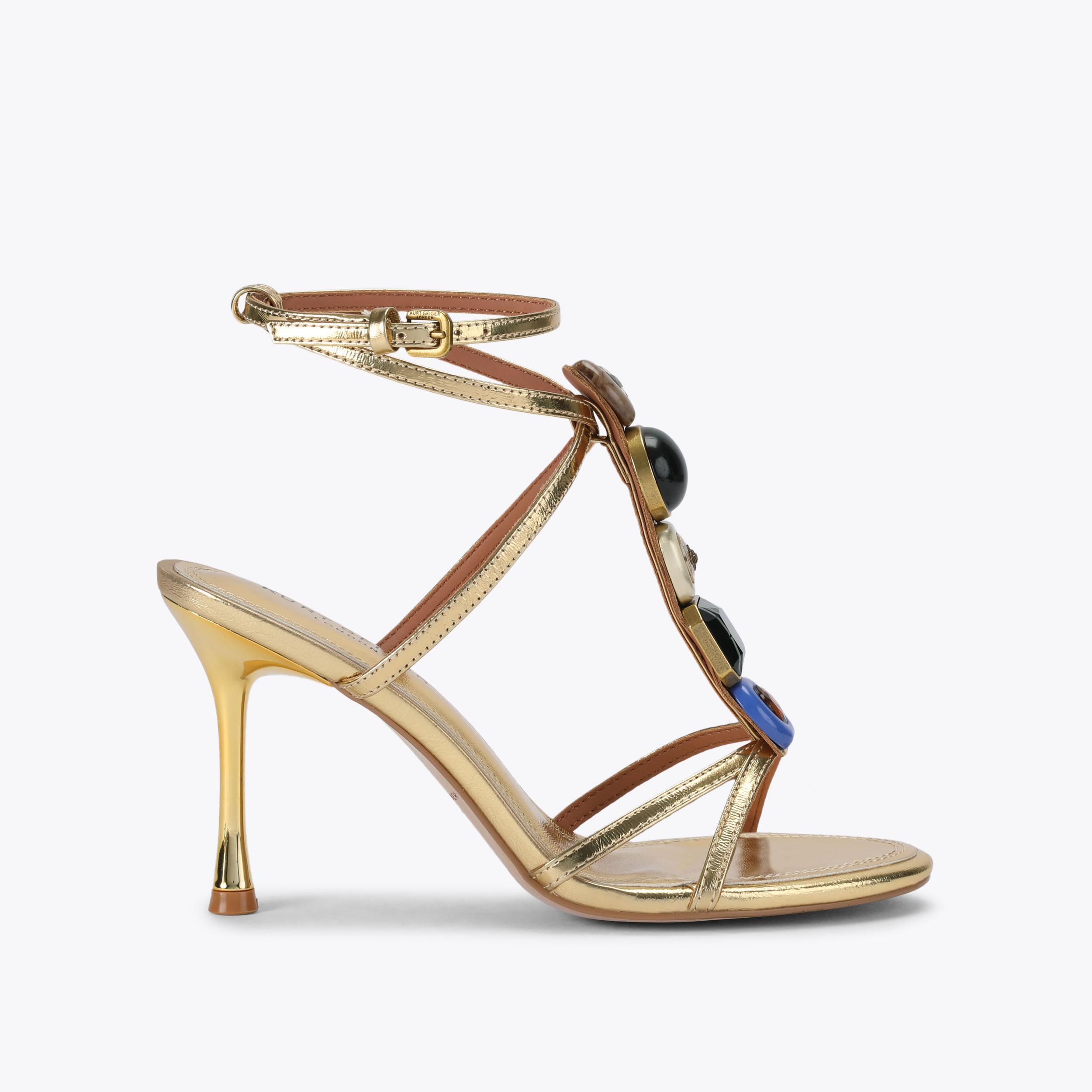 OPHELIA SANDAL Gold statement LouLou Heel crafted from a metallic