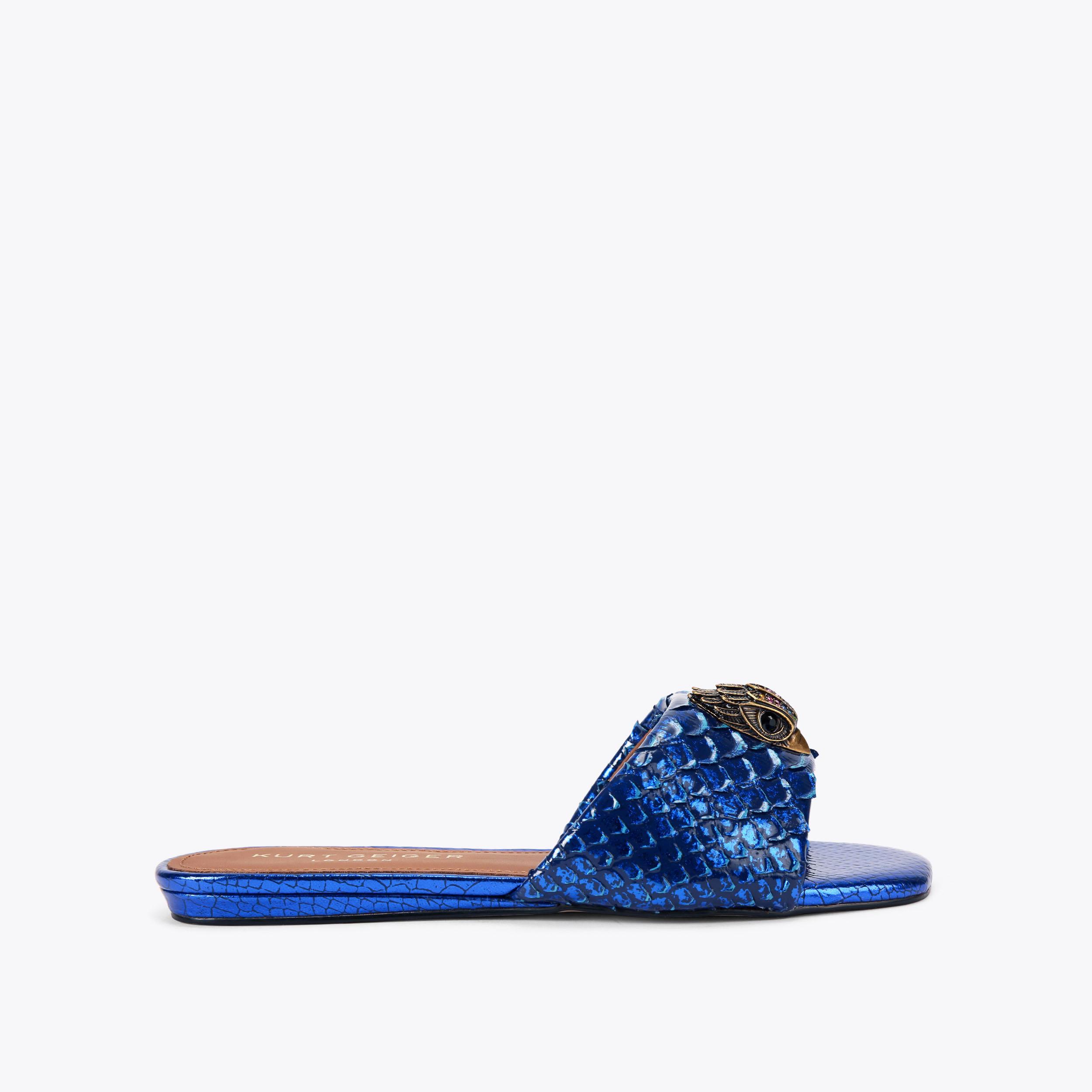 たわし KENSINGTON FLAT SANDAL Blue Metallic Slip On Sandal by KURT